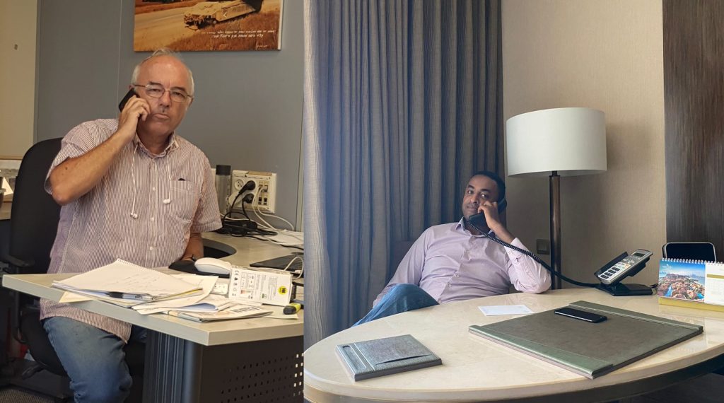 Agrotop’s Stanley Kaye (left) receiving phone call from Abu Dhabi, conversation with Fasika, one of the owners of Nutropia who lives in Abu Dhabi and is working with Agrotop in Ethiopia. 